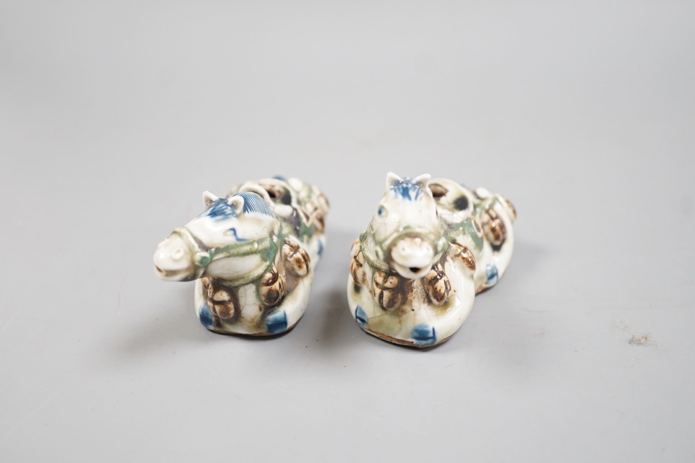 A pair of Chinese stoneware 'horse' rose water droppers, 10cm long